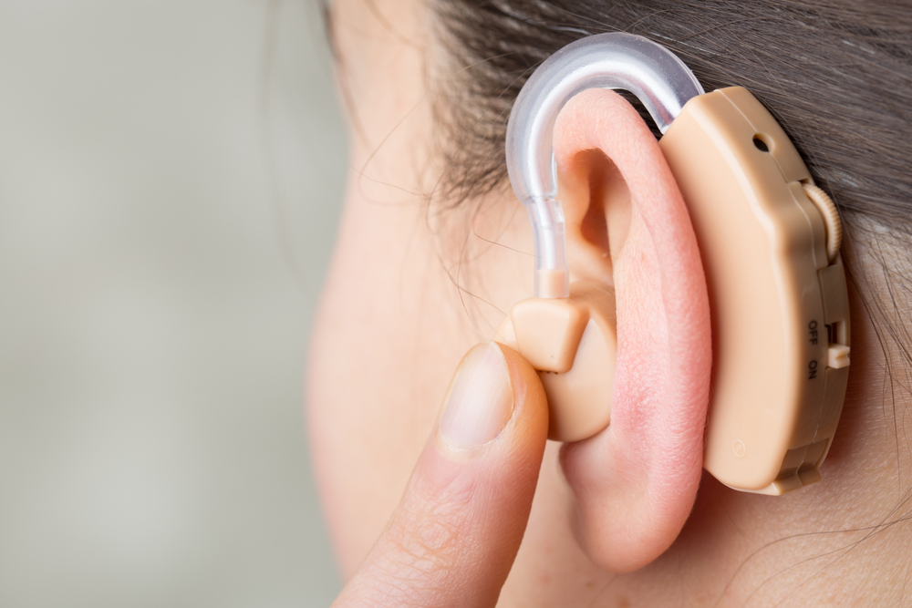 Close Up,of,hearing,aid,in,the,ear,of,a,girl