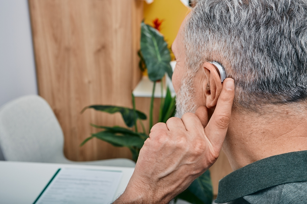 Hearing,solutions,for,elderly,deafness,people.,older,gray Haired,man,tunes