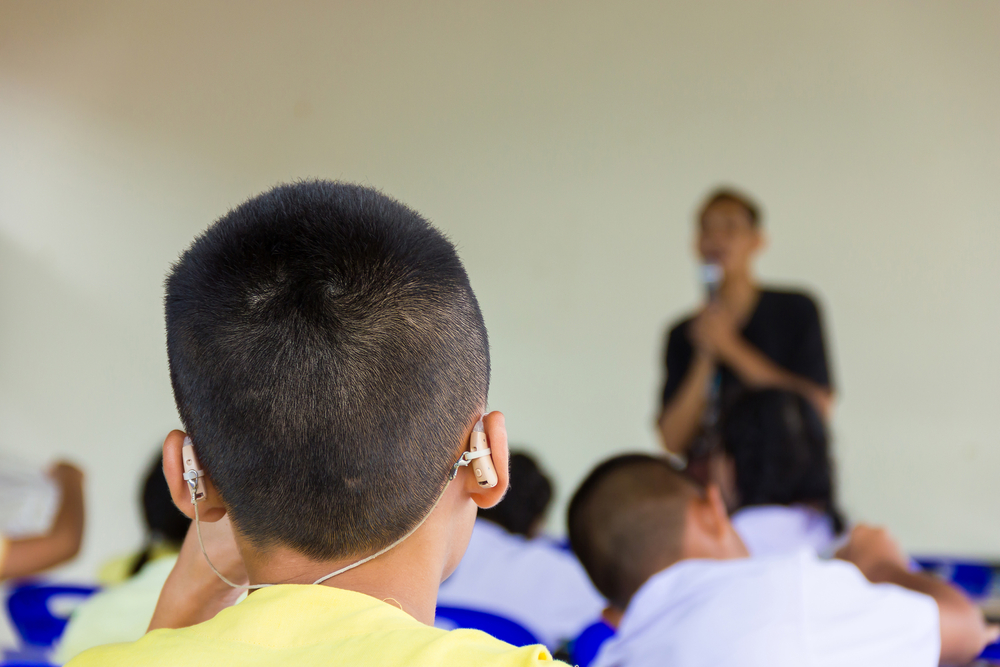 Asian,boy,have,a,hearing,aids.